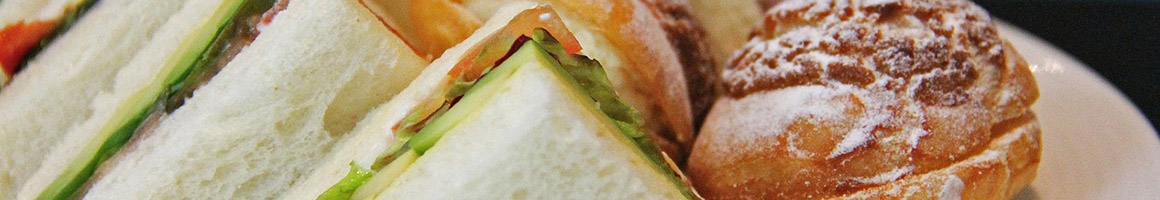 Eating Deli Sandwich at Vince's Deli & Sub Shop restaurant in West Palm Beach, FL.